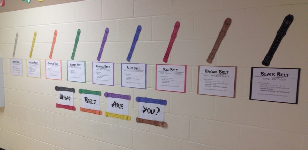 Paper recorders in a variety of colors with accompanying signs.