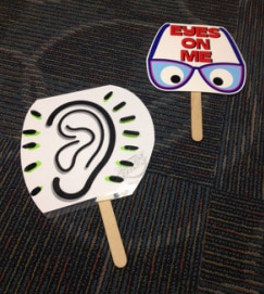 Hand held signs for communication with students.