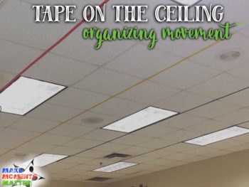 I put tape on the ceiling to help organize our classroom space. One line for each family.