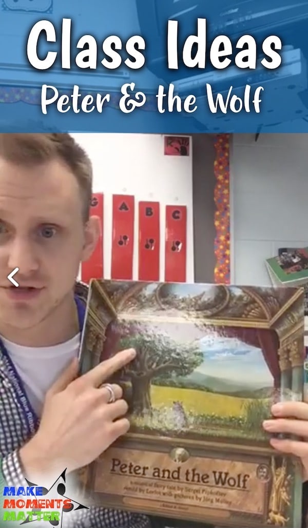 Male teacher holding book of Peter and the Wolf