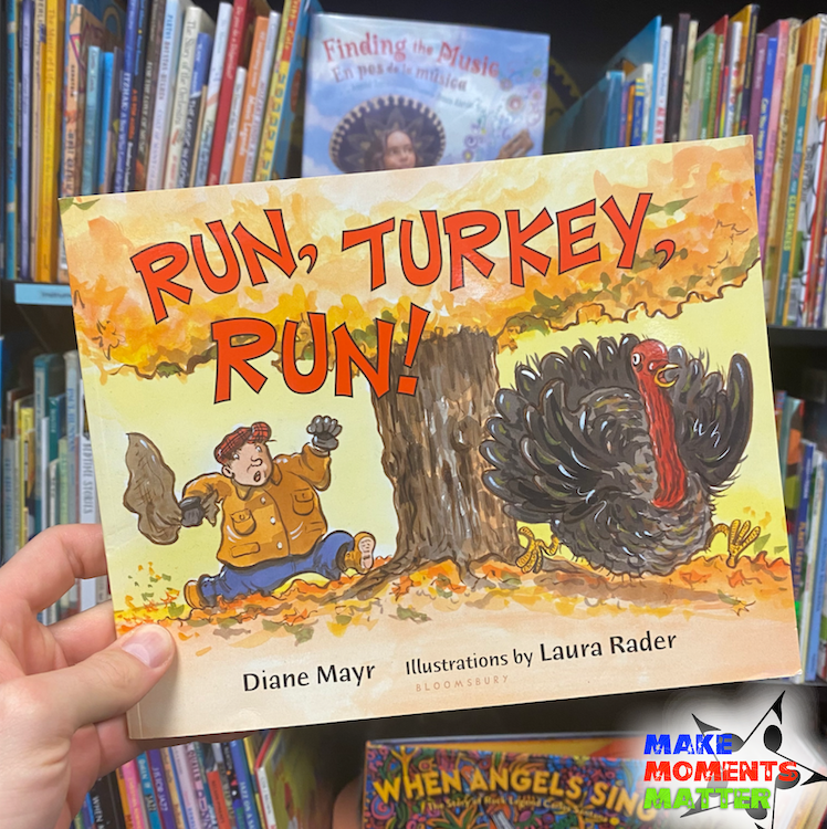  The book "Run, Turkey, Run" held in front of a bookcase.